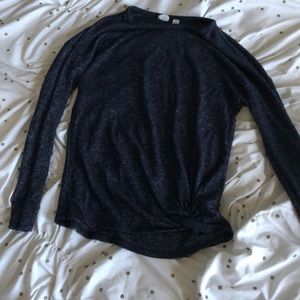 A navy shirt and it is long sleeve.